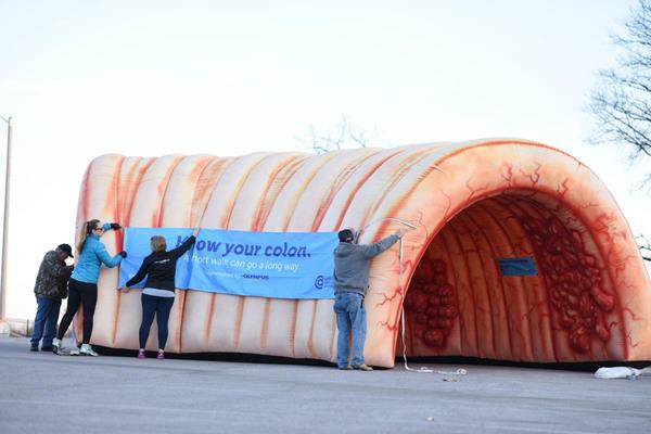 Colorectal Cancer Alliance staff and volunteers set up a giant inflatable colon at the St. Louis Undy RunWalk on March 23, as part of the Big Colon Tour supported by Olympus. (Photo credit: Marta Payne) 