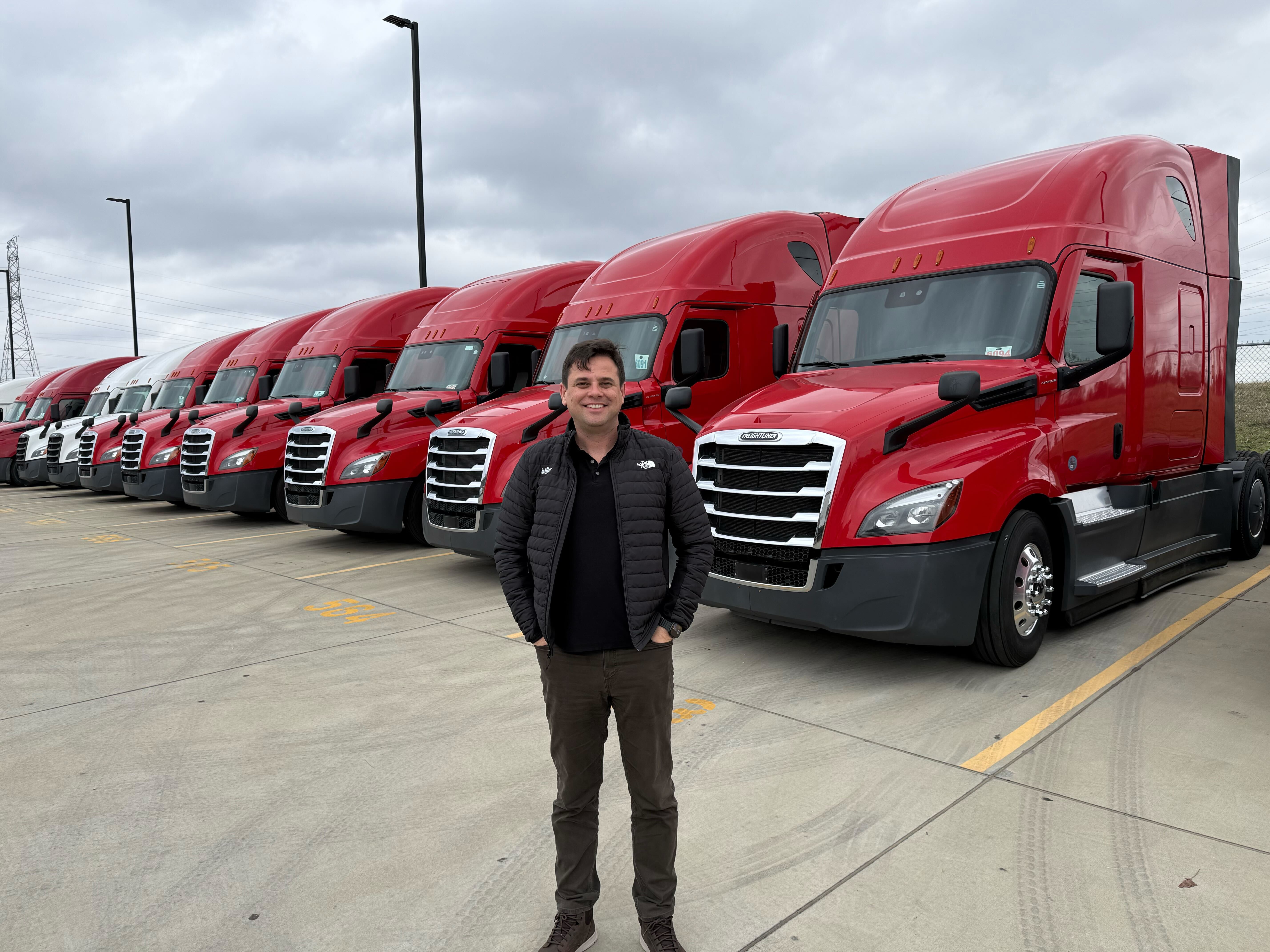 Vincent Goetten, CEO of Billor, alongside the first trucks deployed under Billor for Lease Sponsors.