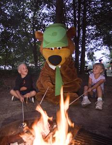 Kids and Yogi Bear at campfire