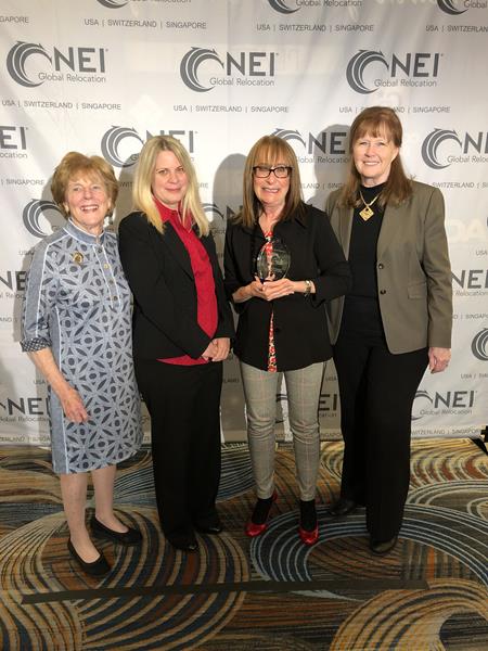 From left to right: Kate Dodge, NEI Chairman; Mary Stang, Furnished Quarters Global Account Manager; Doris Kampf, Furnished Quarters Senior Director of Global Sales; Randy Wilson, NEI President/CEO