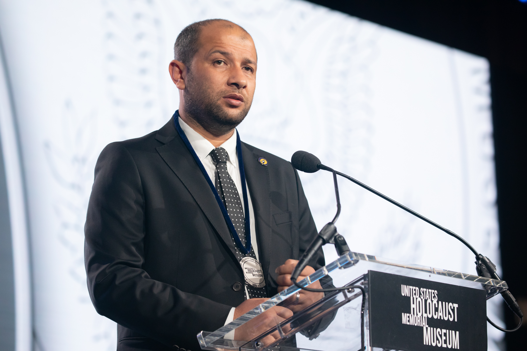 Raed Saleh, the lead organizer of the White Helmets, accepts the 2019 Elie Wiesel Award, the United States Holocaust Memorial Museum’s highest honor, on behalf of the Syria Civil Defence. To date, 261 members of the White Helmets have been killed while saving more than 115,000 lives. Credit: U.S. Holocaust Memorial Museum