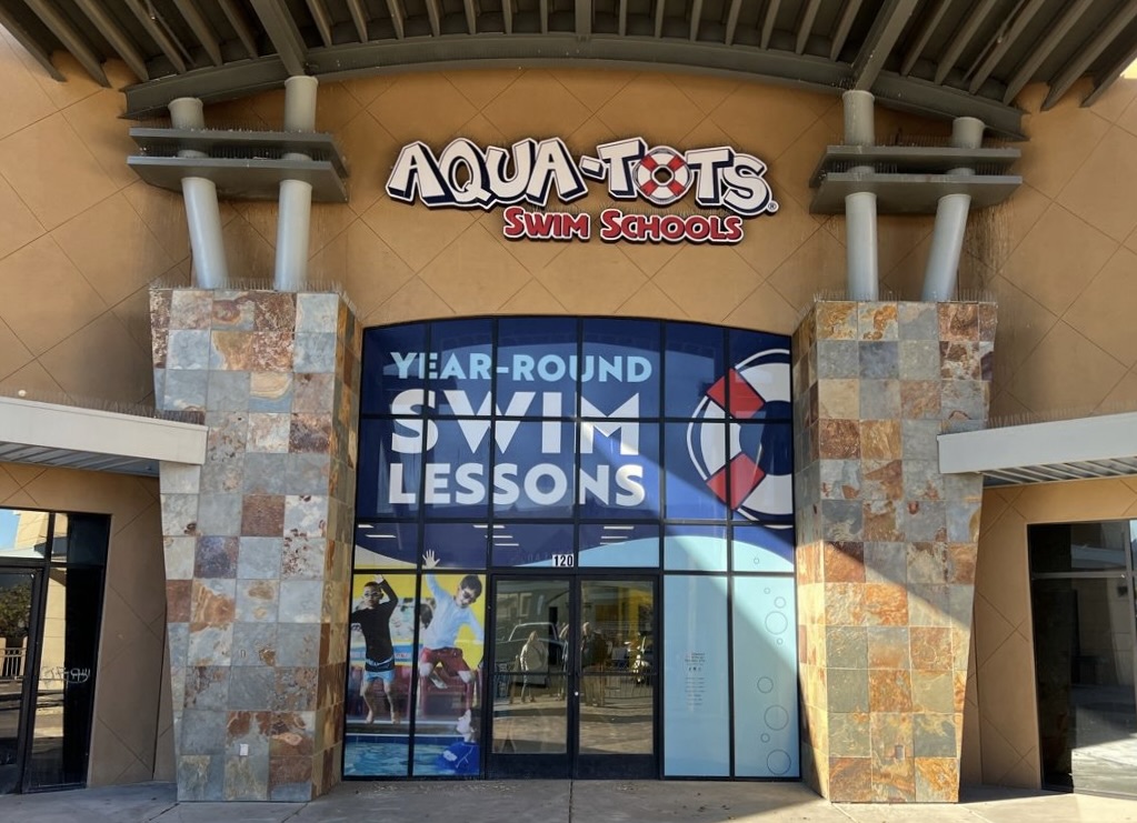 This brand-new, state-of-the-art swim school features multiple swim zones, a glass-paneled viewing area and front row seats to your child's swim lessons in the signature cozy, red Aqua-Tots armchairs.