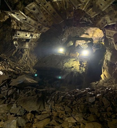 Underground scoop moving blasted rock at Silver Strand