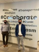 While the GrantMatch team continues to work remotely during the COVID-19 pandemic, Managing Partners Dan Civiero, (left), and Mike Janke are pictured in front of the GrantMatch culture wall at the Oakville office during a recent visit