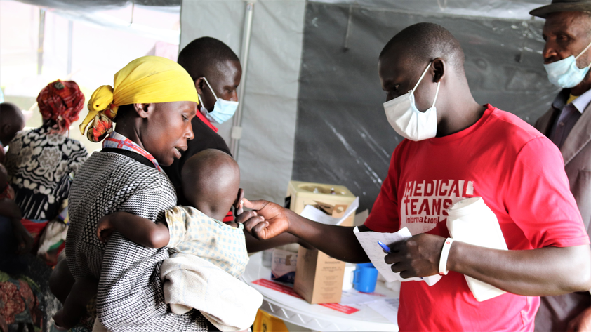 Medical Teams staff treating mother and child in Kisoro