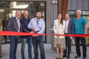 Project partners cut the ribbon at the grand opening of Merewood Apartments at 411 & 423 Despard Avenue, Parksville, British Columbia.