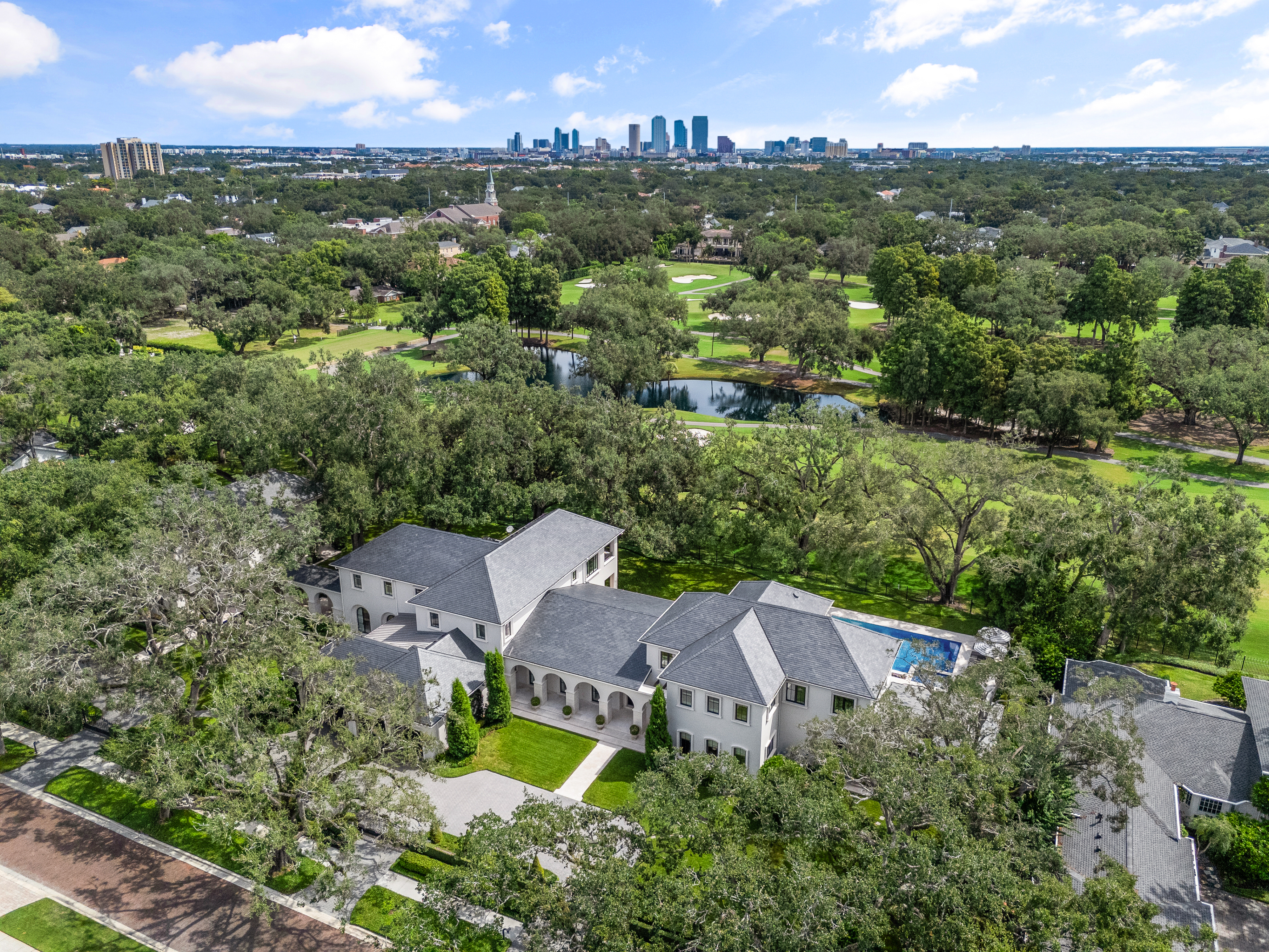 914 Golf View Drive exterior with skyline of Tampa in the distance. This sprawling estate was exclusively marketing by Paul DeSantis of Premier Sotheby's International Realty's South Tampa office.