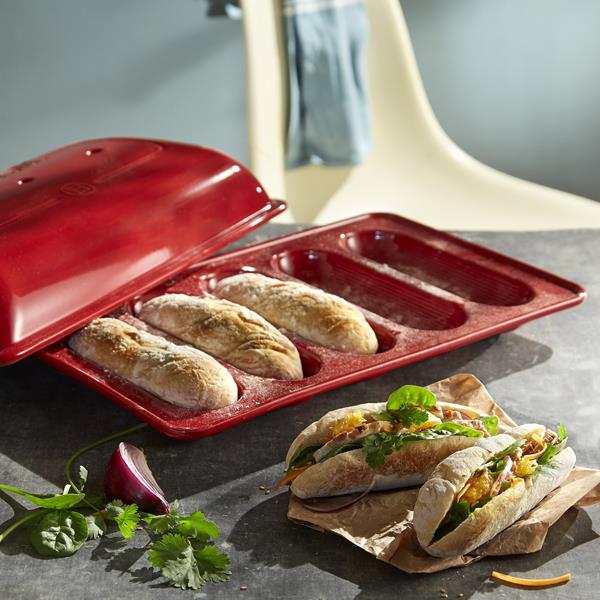 The domed lid traps steam to create the crackly exterior and airy interior classic baguettes are famous for.