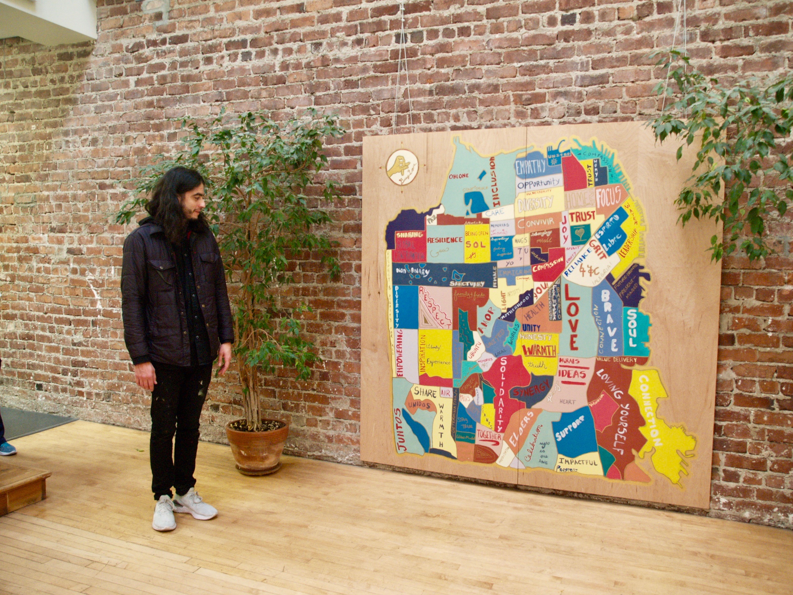 Christo Oropeza stands in front of the final artwork.