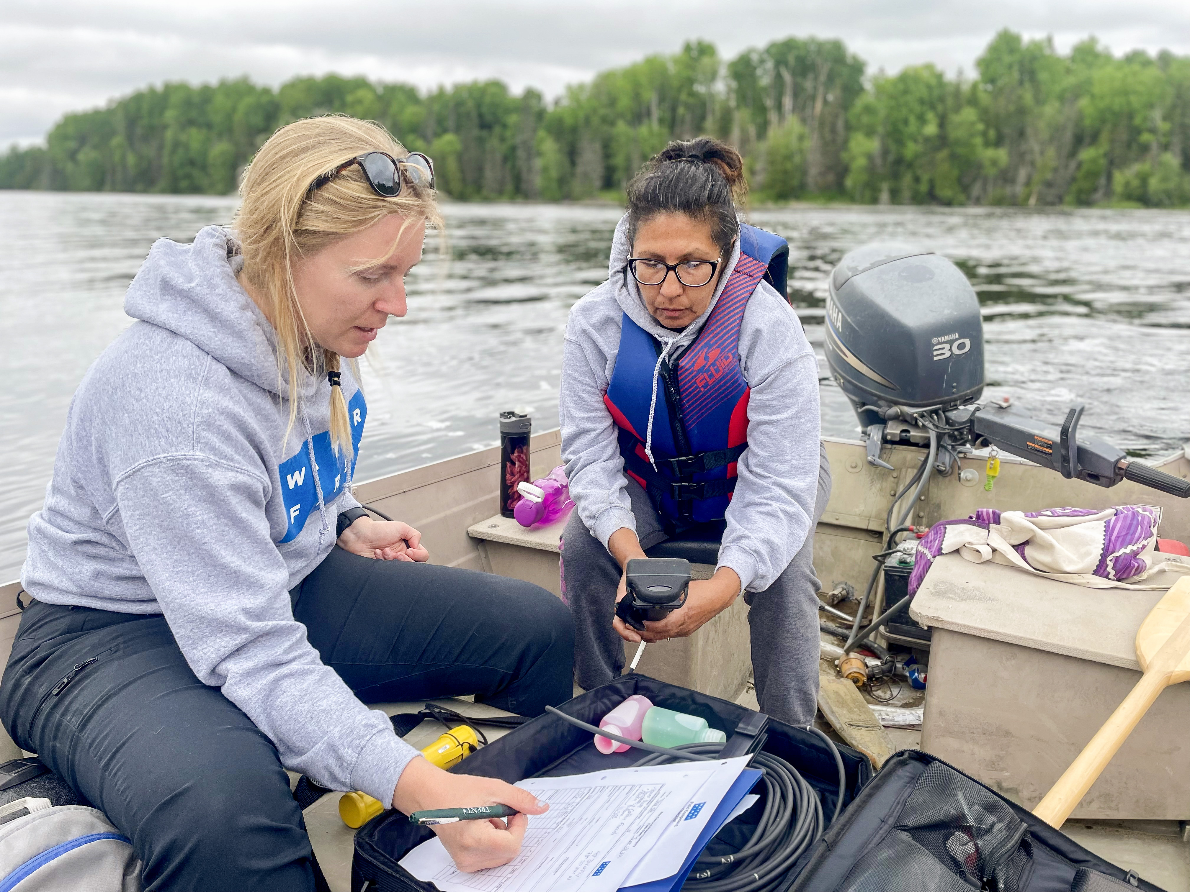Brooke Harrison, Water First Trainer & program participant Nathalie Mathias collecting data on a local lake
