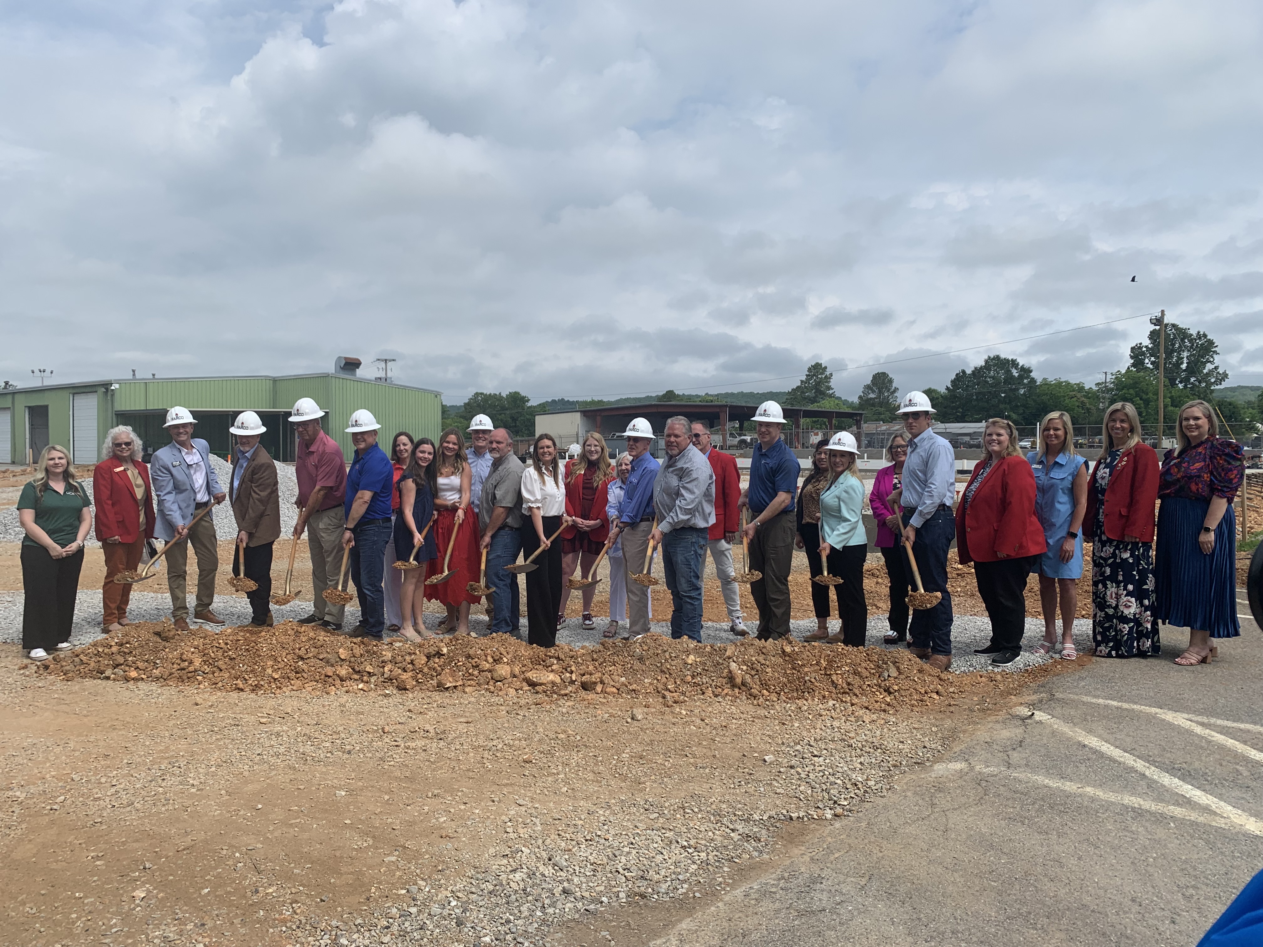 LaCroix Precision Optics executives, Governor Sarah Huckabee Sanders, and local leaders gathered to announce the company's latest expansion in Batesville, Arkansas.
