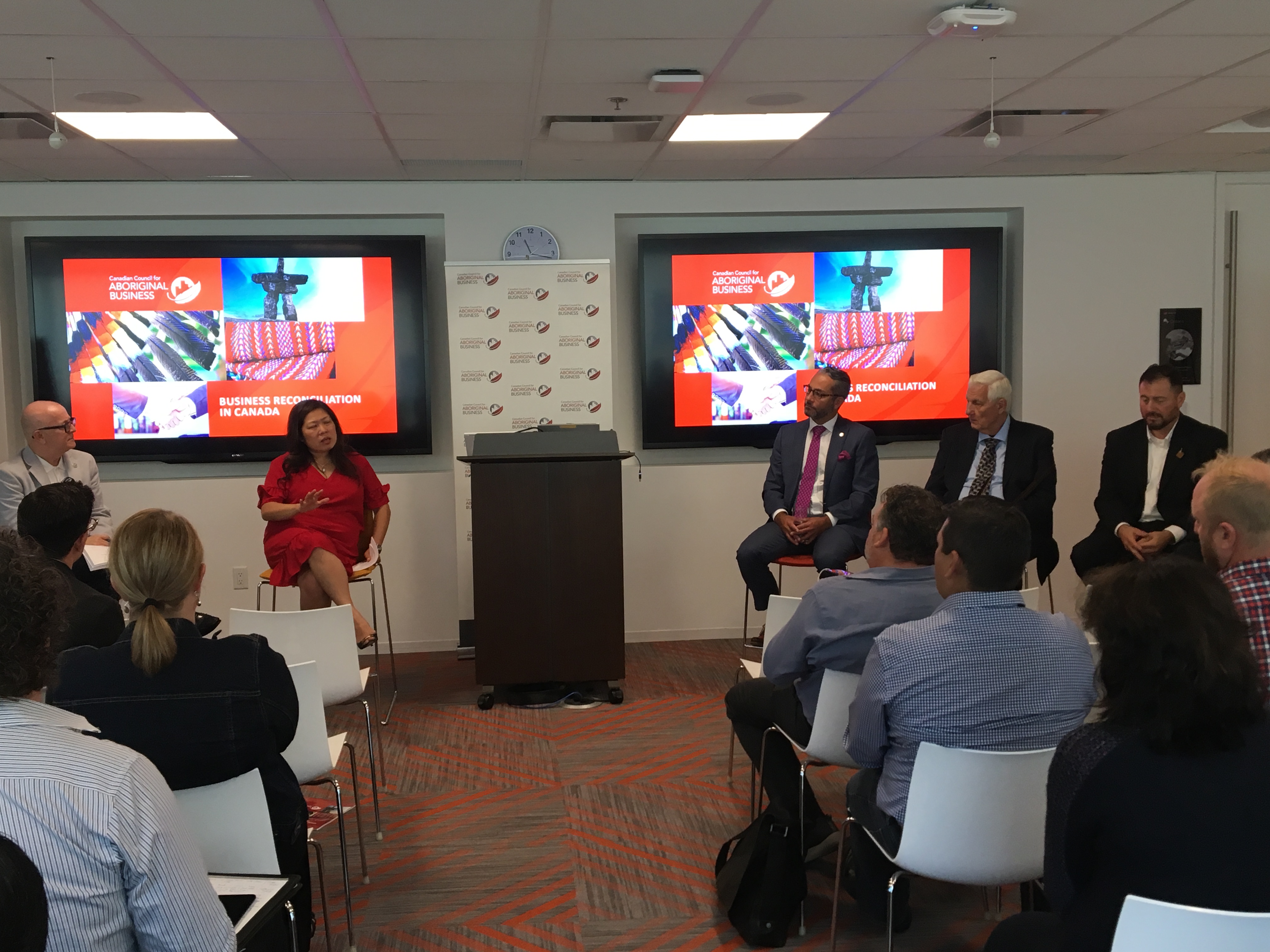 Panelists discuss the importance of business reconciliation and the new Business Reconciliation in Canada Guidebook. 

From left to right: Moderator, Andre Morriseau, and panelists, Minister Mary Ng, JP Gladu, Dr. Elder Bob Phillips, and Mark Sevestre.