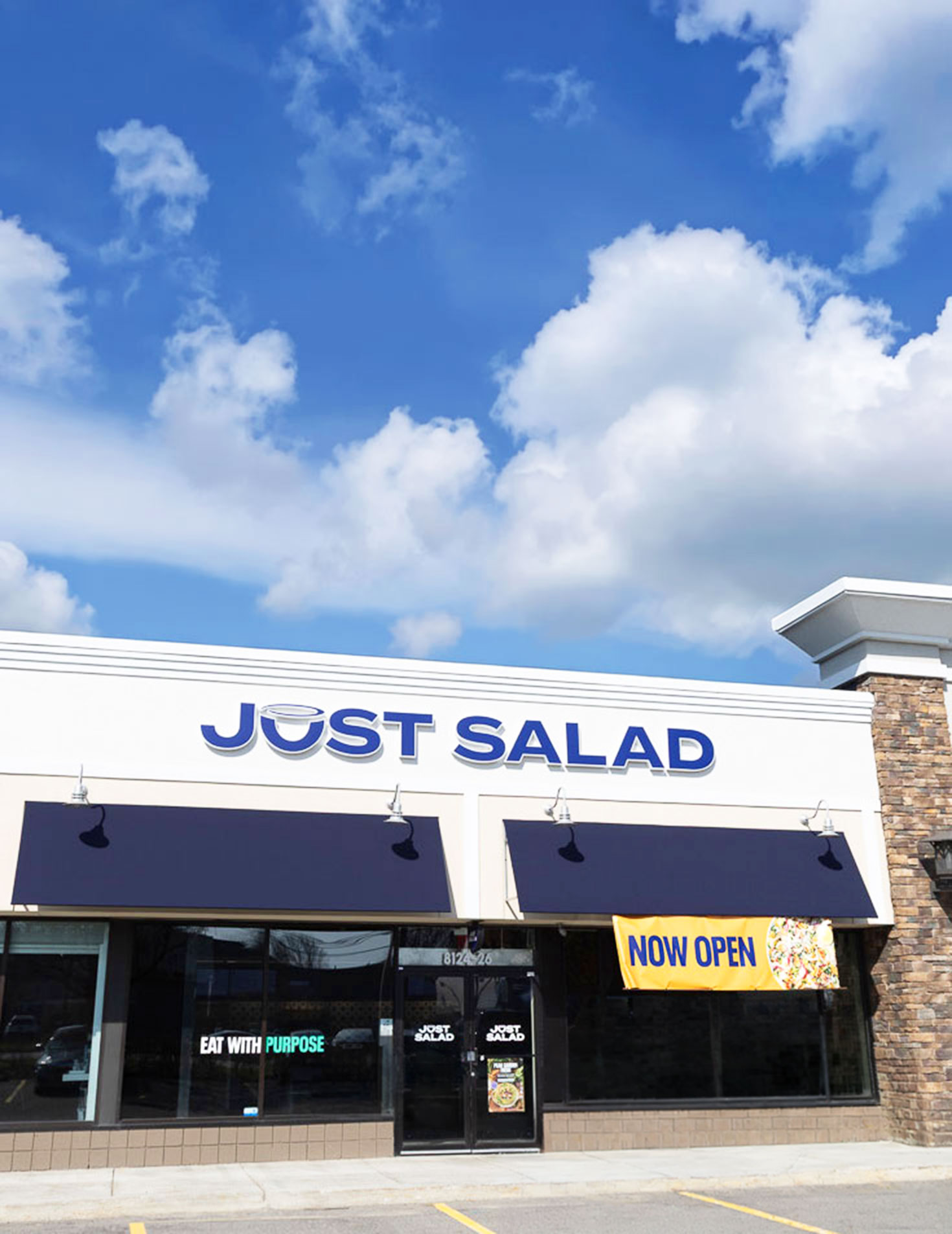 Exterior storefront of Just Salad in East Amherst, New York.