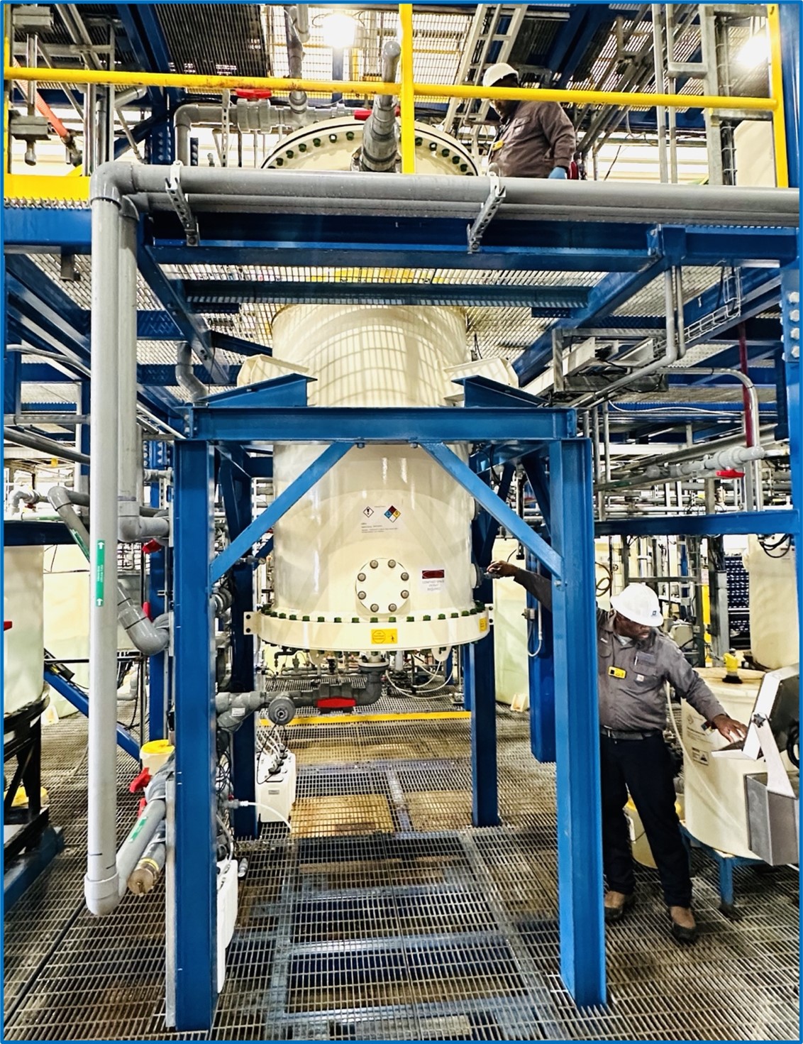 Side elevation of operators working on the commercial-scale DLE column at Standard Lithium's Demonstration Plant near El Dorado, Arkansas