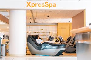 Customer enjoying HydroMassage Chair at XpresSpa