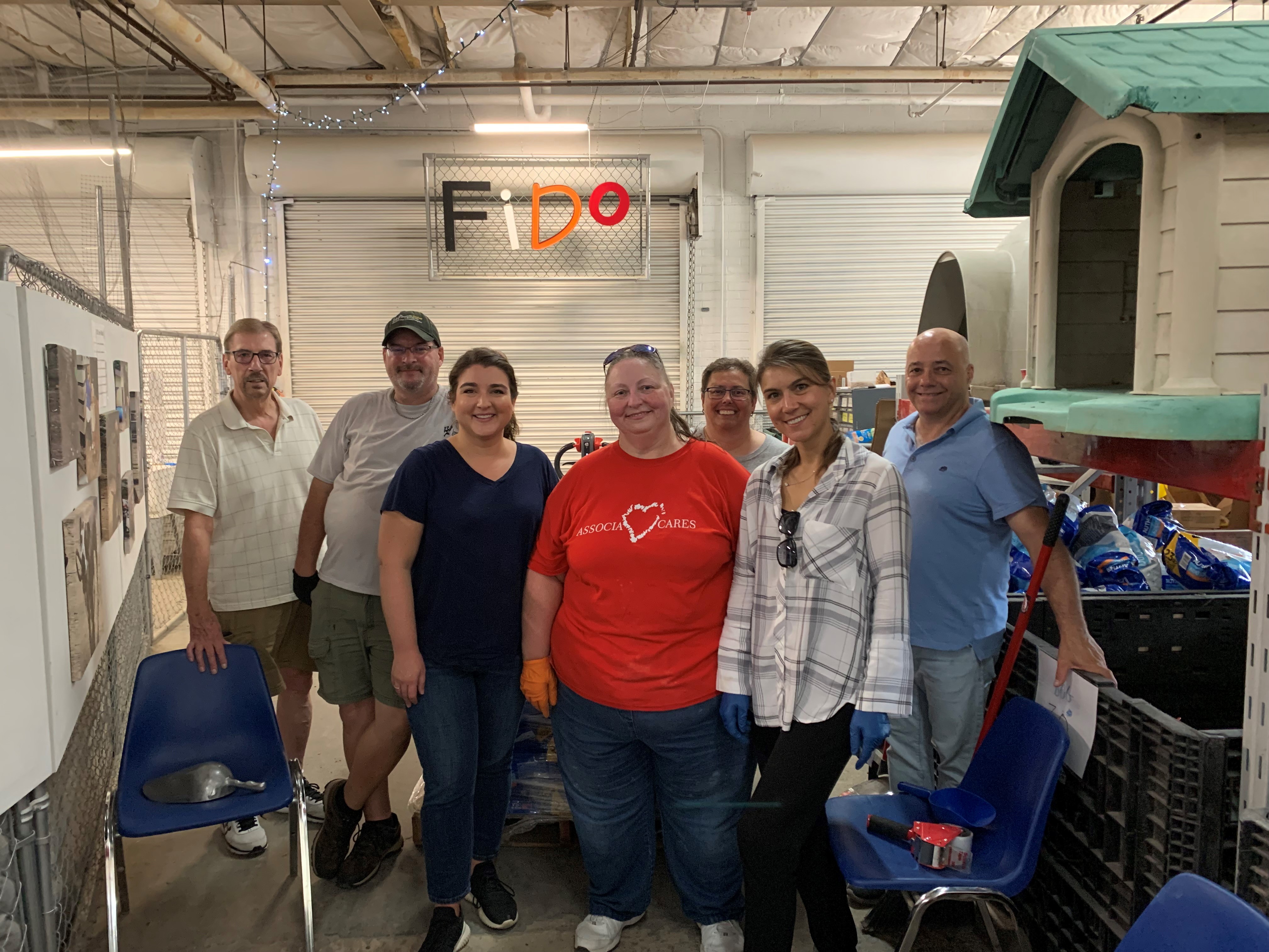Associa Community Association Services of Indiana took time out of their workday to volunteer at Friends of Indianapolis Dogs Outside (FIDO)