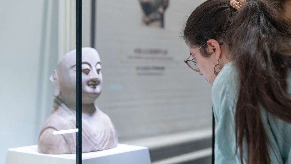 A visitor views an exhibit at an exhibition of cultural relics from China's Hebei province, in Belgrade, Serbia, Sept. 10, 2026.: A visitor views an exhibit at an exhibition of cultural relics from China