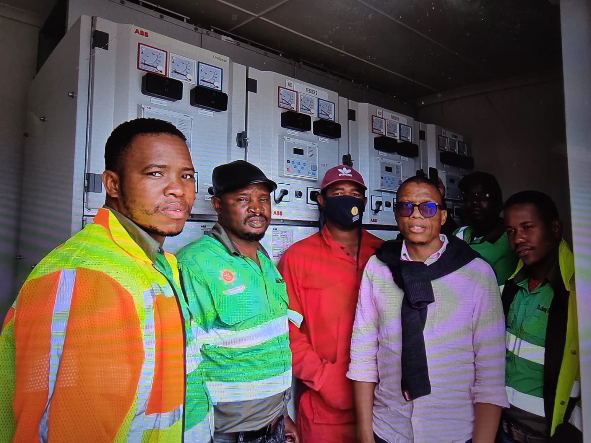 Workers installing MBAK BESS unit in Zambia
