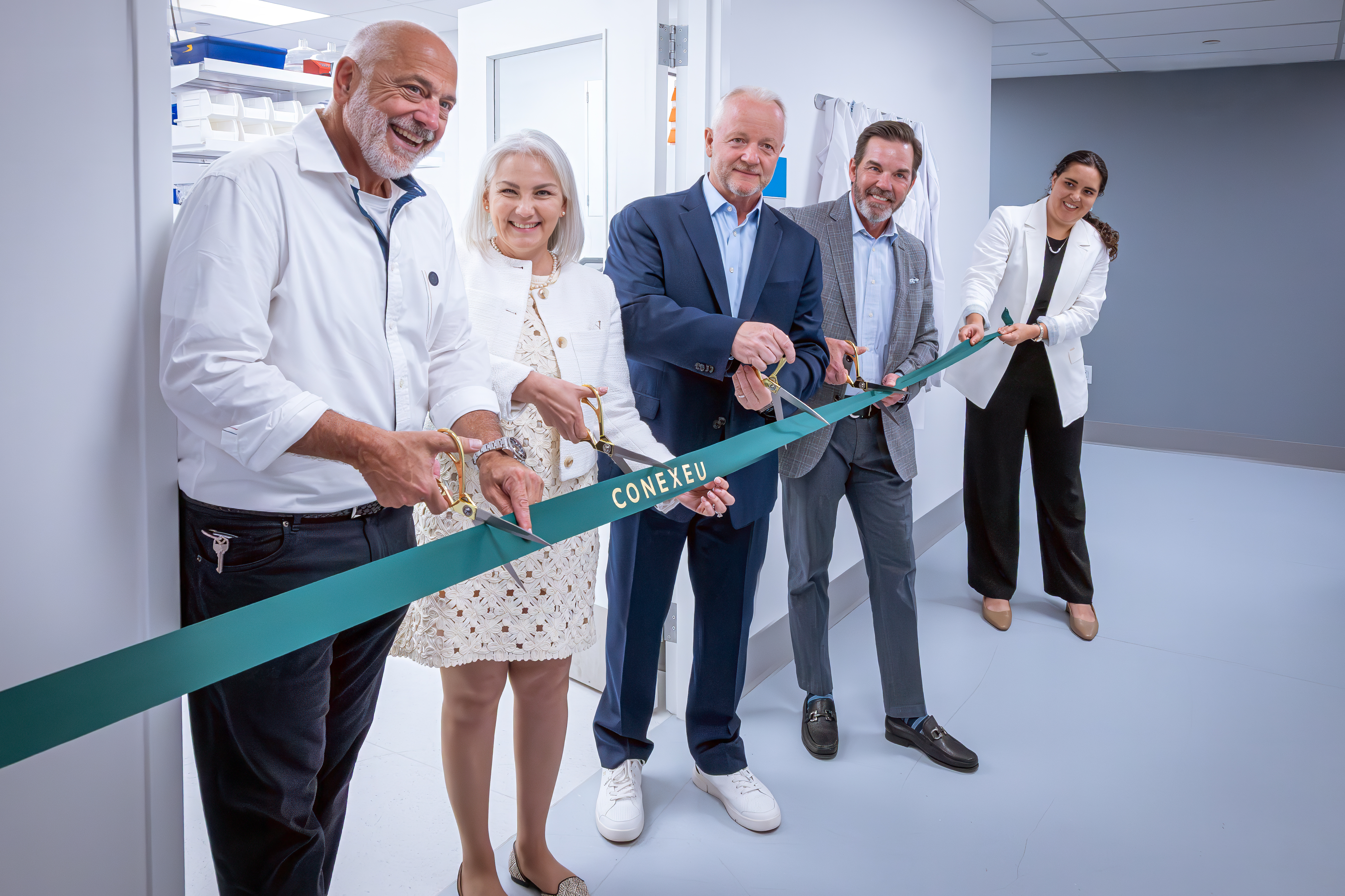 Conexeu Sciences' leadership team celebrates the opening of the company's new laboratory. Pictured from left: David Bogart, Chief Commercial Officer; Dr. Claudia Chavez-Munoz, Chief Science Officer and Co-Founder; Miles Harrison, CEO and President; Dr. Brian Pilcher, Chief Medical Officer; and Ana Lorenzo-Leal, Research Lead.(Photo Credit: Peter Marlin)