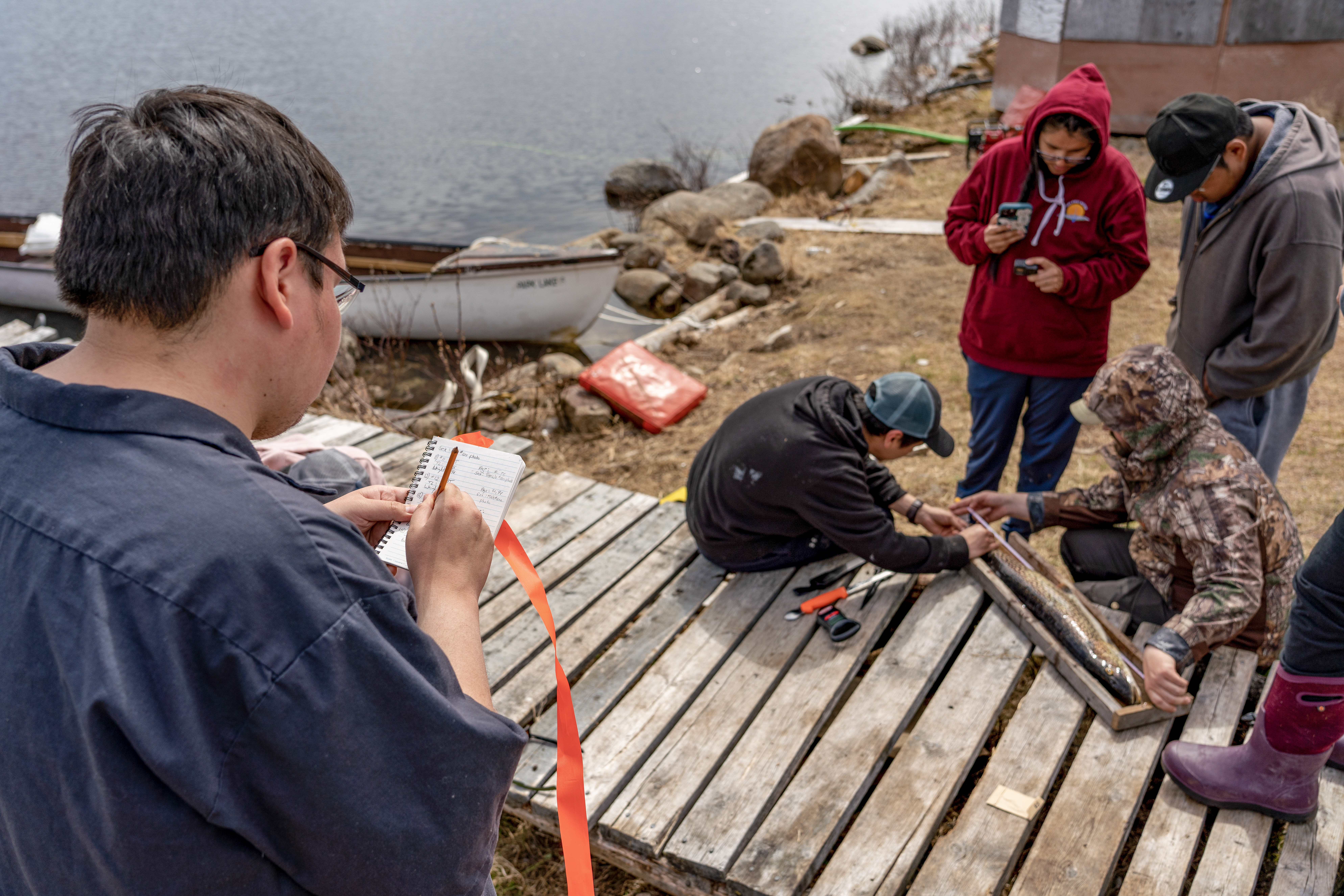 Water First participants learn how to record data collected from a fish population study, Park Lake Labrador