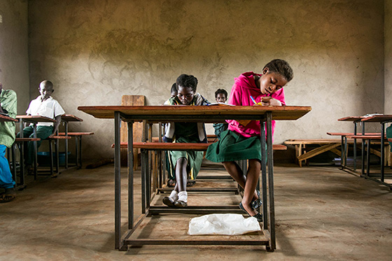 Student working at a desk in Zambia