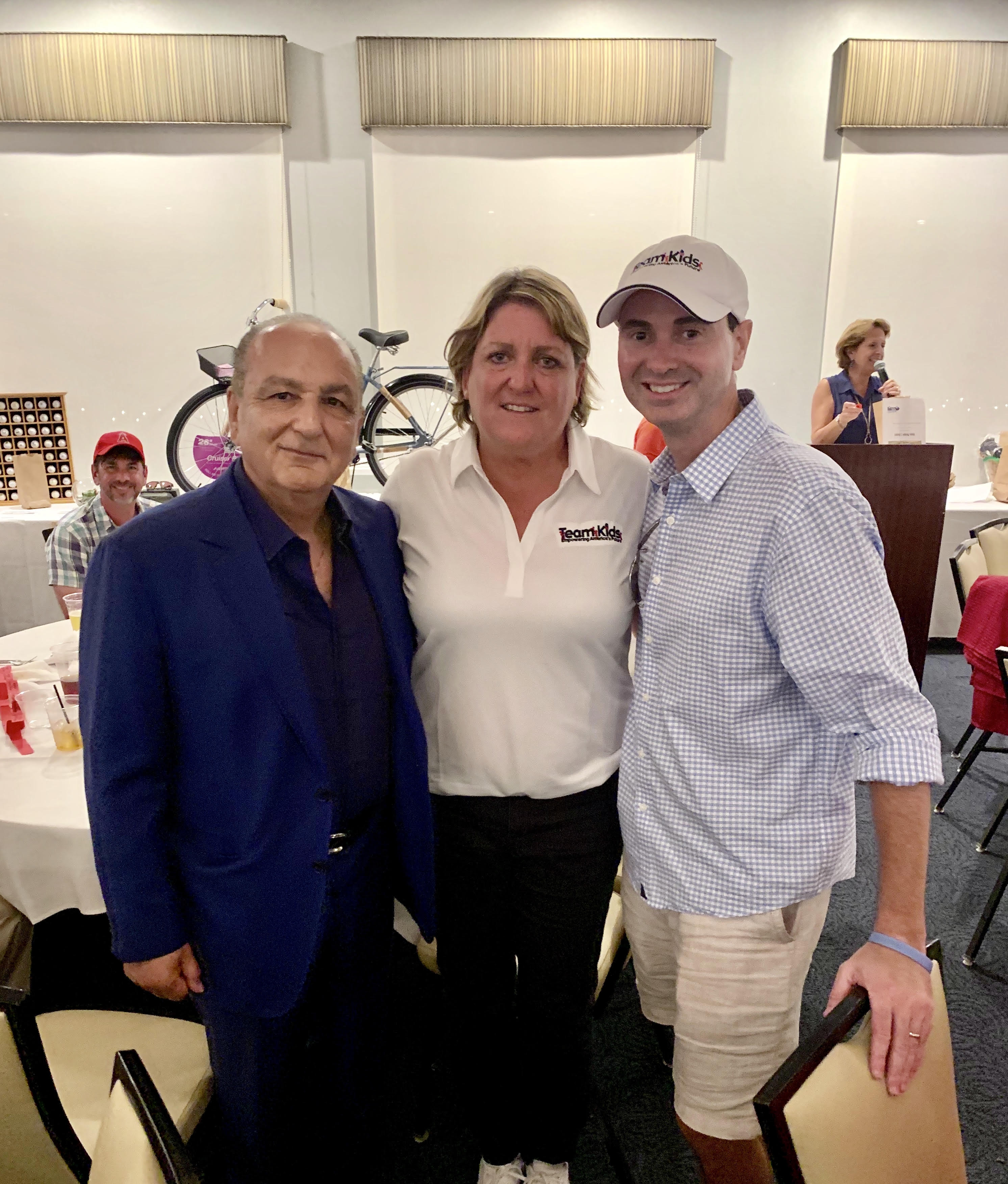 Pictured from left: Cameron Merage, founder and CEO, First Team Real Estate; Julie Hudash,  founder and CEO, Team Kids; Charles Glorioso, Macquarie Group Foundation