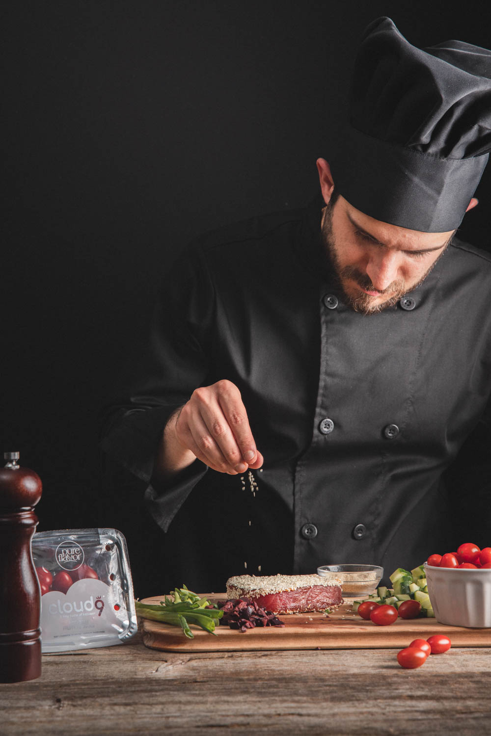 A chef prepares Tomato Salad with Sesame Tuna, a recipe made with Cloud 9® Bite-Sized Fruity Tomatoes.