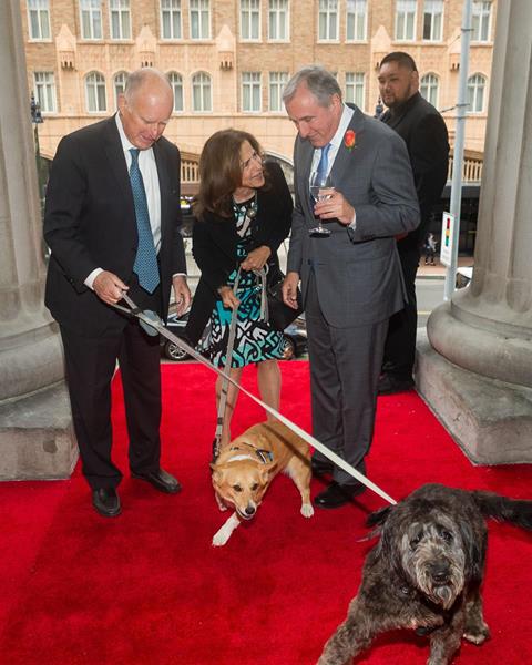 Governor Jerry Brown Jr. and wife Anne Gust Brown accompanied by their two dogs, Calle (poodle) and Colusa (corgi), are greeted by Michael Sangiocomo, Board Chair of the California Historical Society, prior to the start of the California Historical Society annual Gala at the Old U.S. Mint in San Francisco