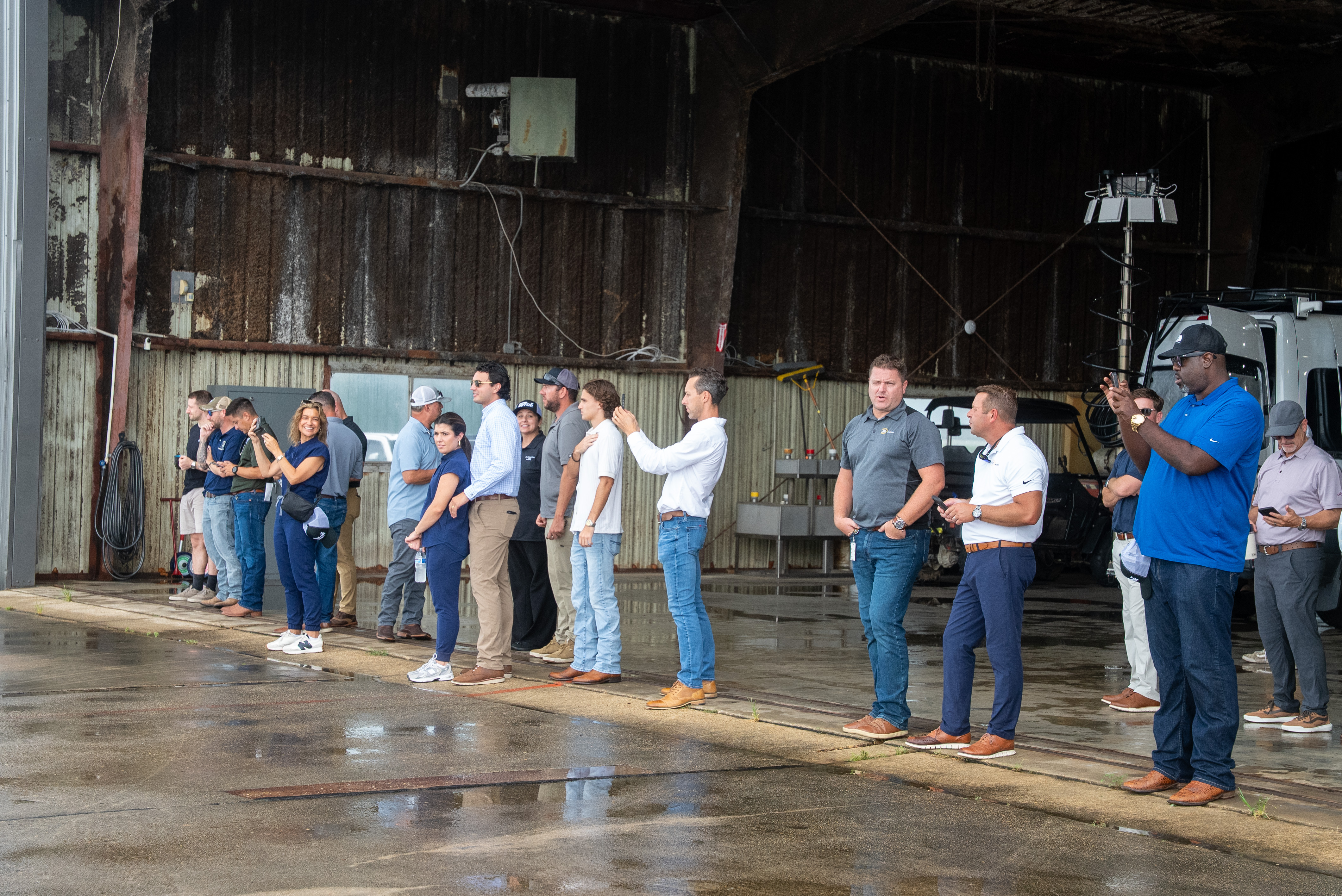 Spectators watch live demonstration of remotely piloted cargo delivery and offshore resupply with the Robinson Unmanned R44 AIRTRUCK at Acadiana Regional Airport in New Iberia, Louisiana.