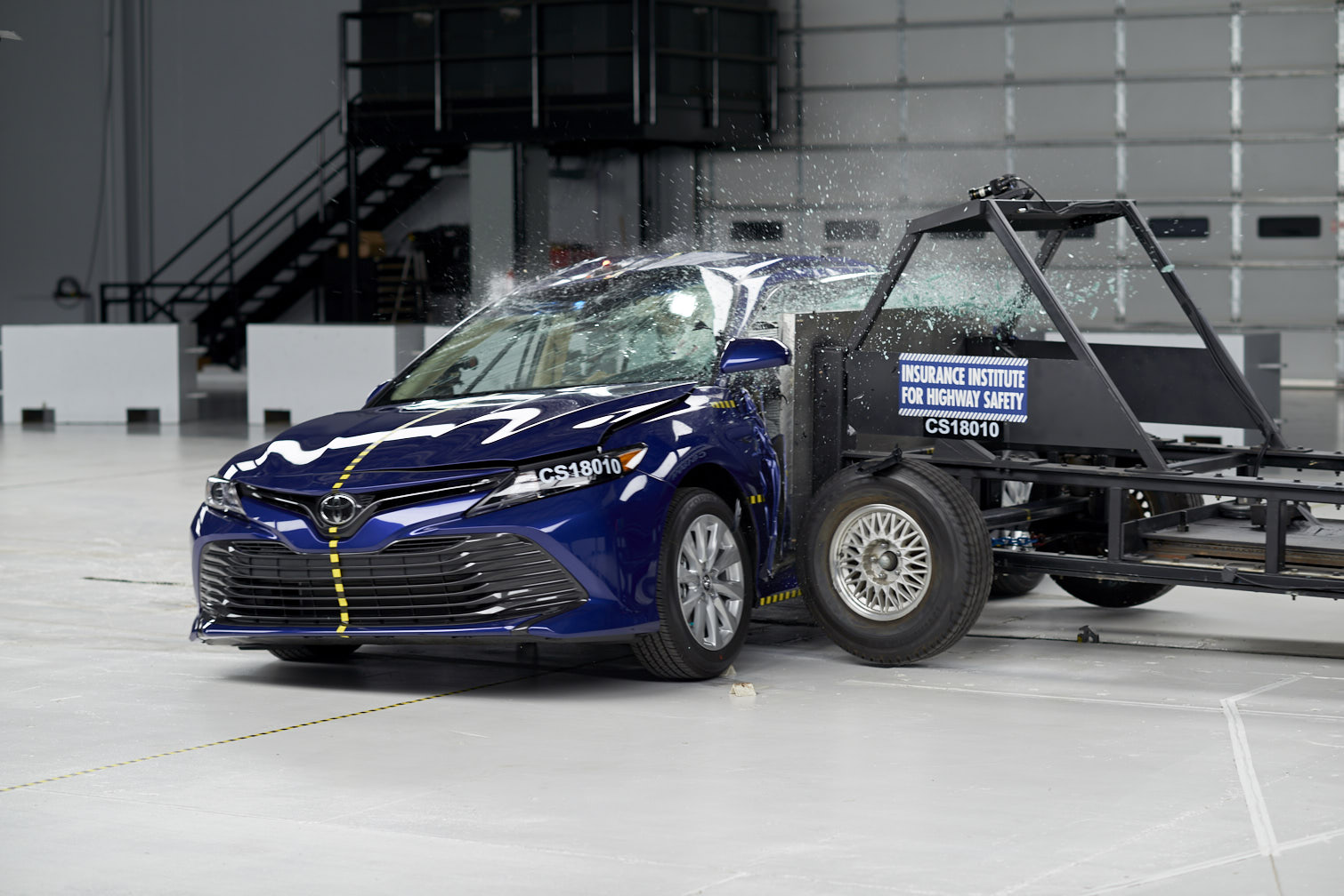 Test vehicle is struck by a movable barrier in a side impact research crash test