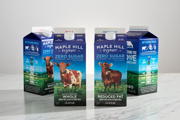 Four cartons of Zero Sugar Organic Milk from Maple Hill front and side of cartons shown