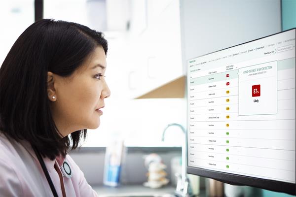 A doctor reviews the COVID-19 detection results of her patient's chest X-ray, showing this patient is 87% likely to have the virus. Photo credit Getty/Epic Systems Corporation