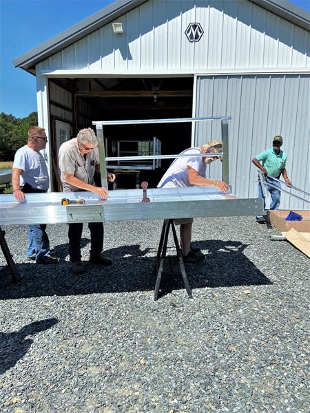 Bay Hundred Community Volunteers assemble a modular wheelchair ramp