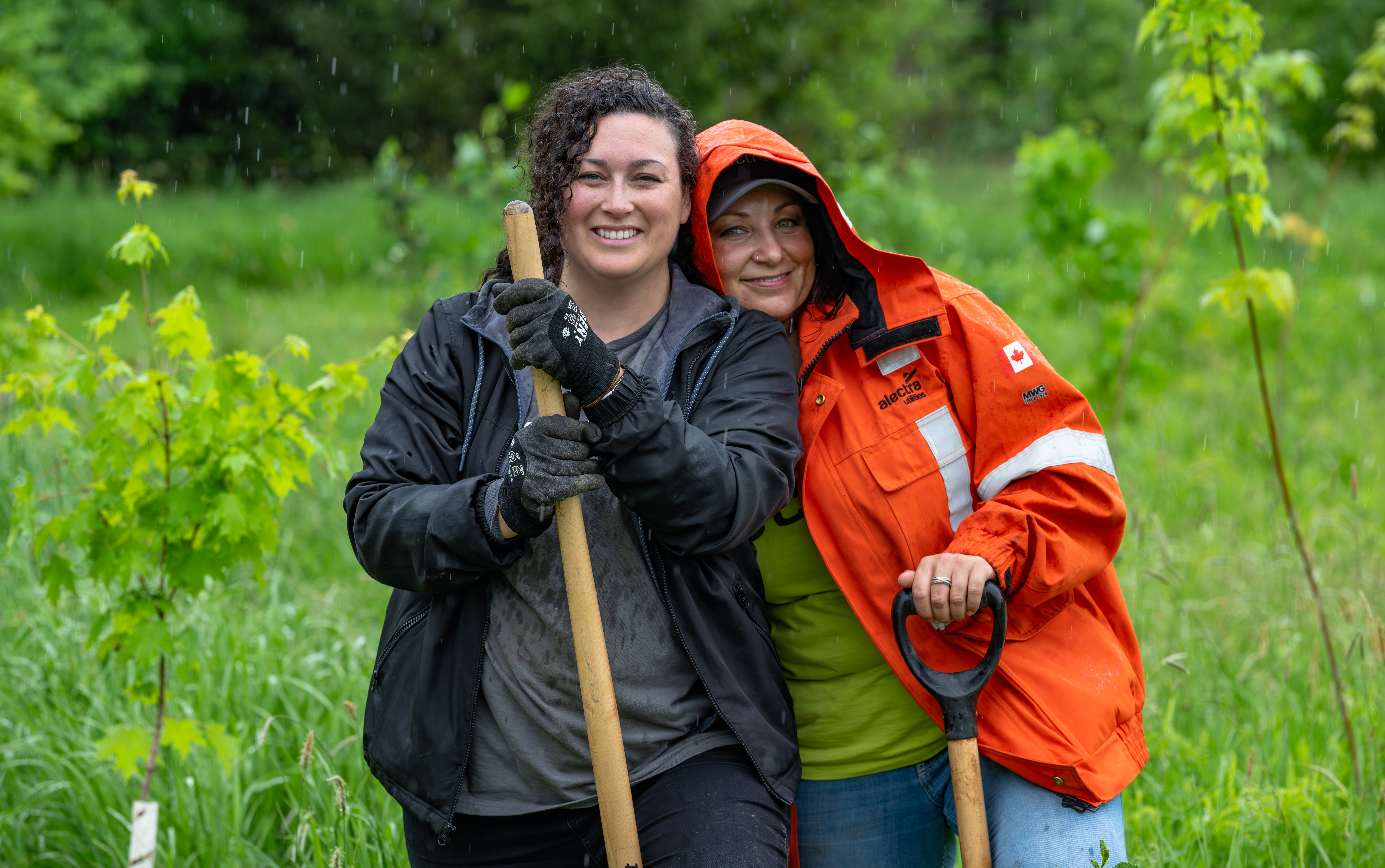 Employees, including Amber Azarcon (left) and Elizabeth Pimentel, at Alectra volunteer with the City of Markham and 10,000 Trees to support the restoration of Monarch Park