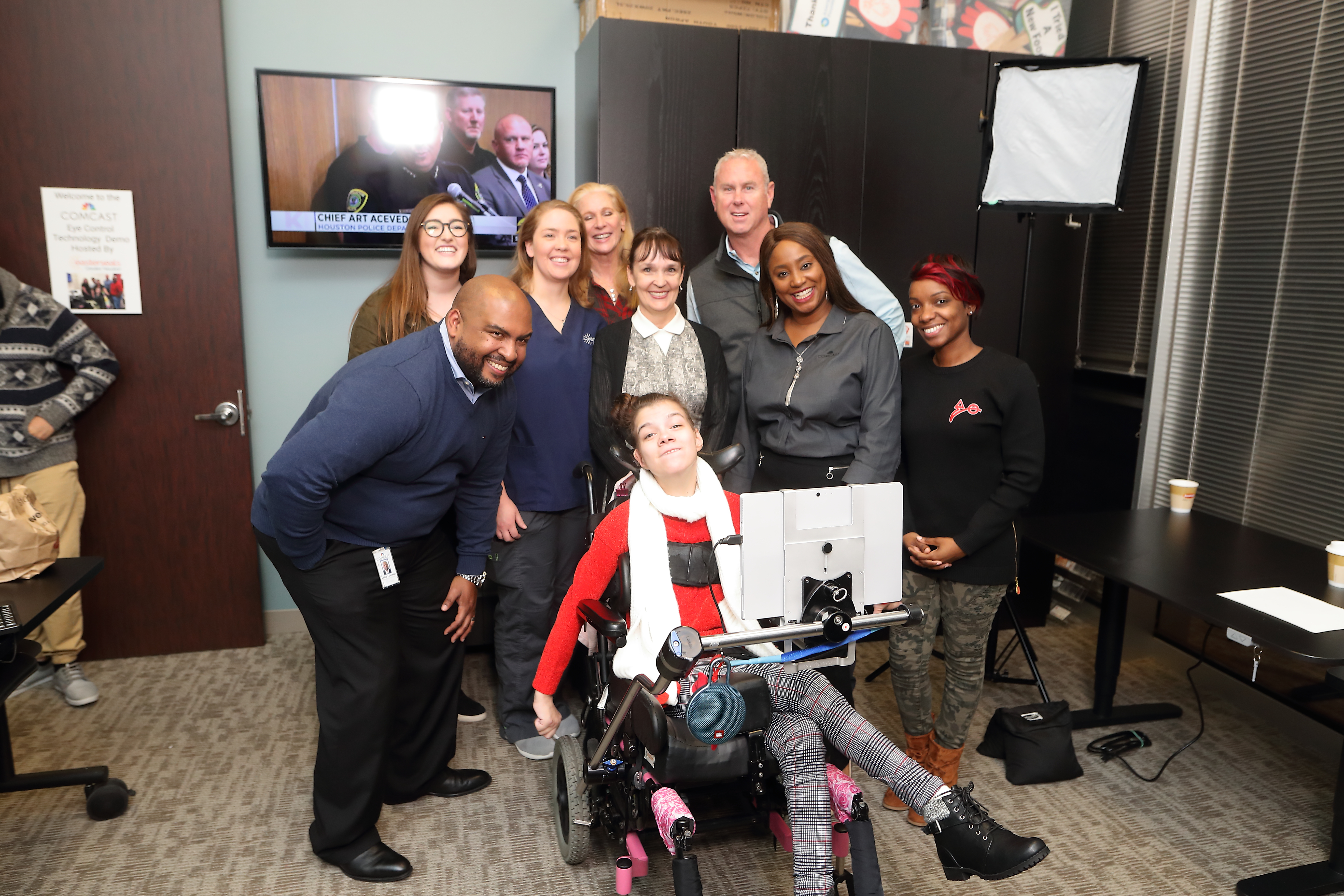 The Comcast Houston team joins BridgingApps and a client in the Accessible Technology Lab.