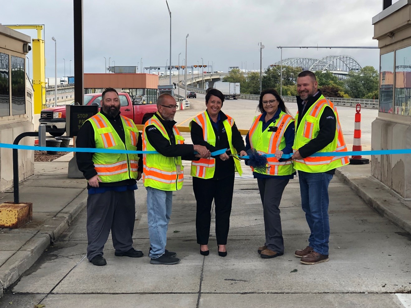 Staff from the Blue Water Bridge cut the ribbon on the new tolling system on the U.S. side of the bridge connecting Port Huron, Michigan, with Point Edward, Ontario. (MDOT photo)