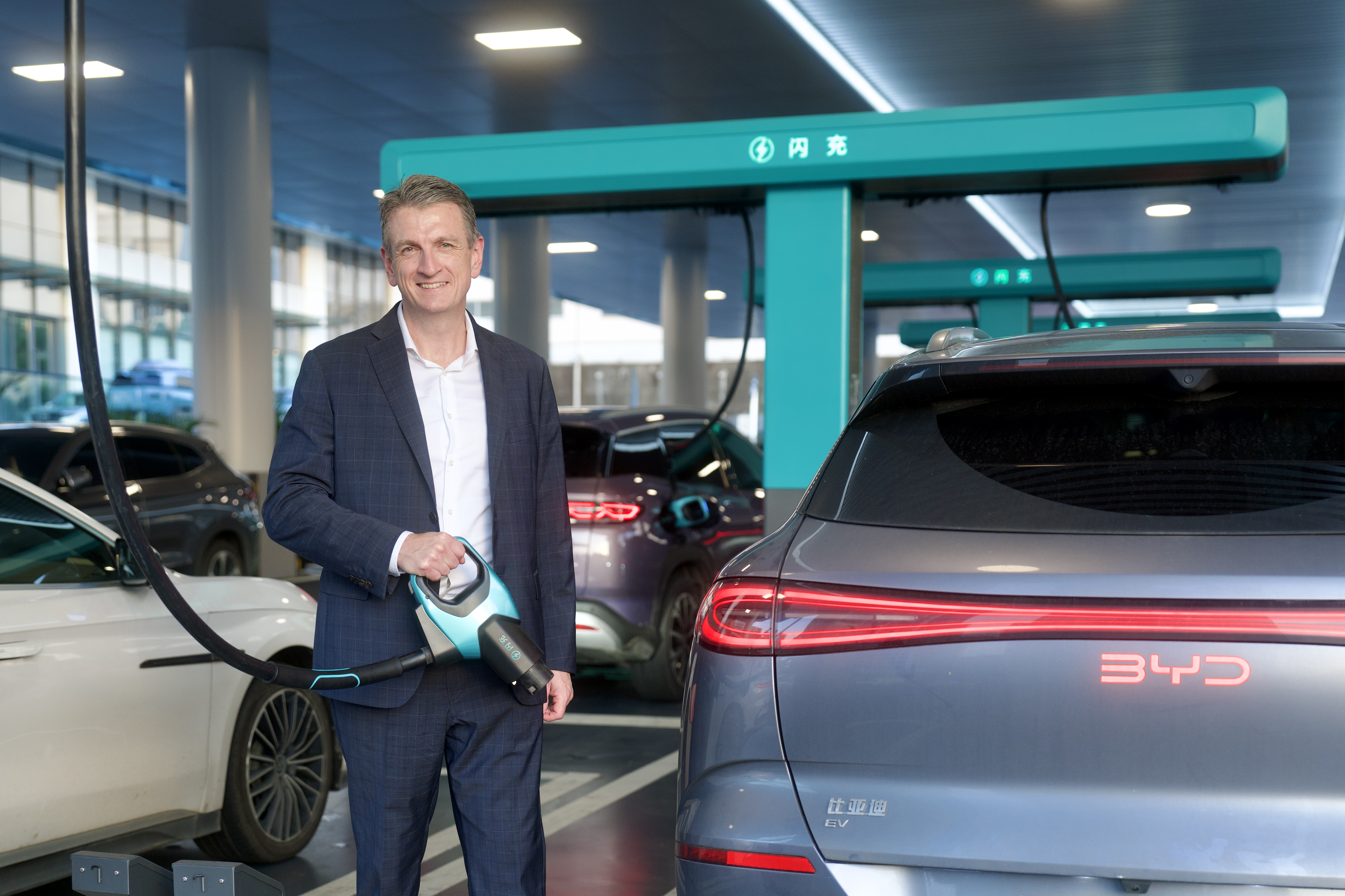 Smart CEO Scott Wharton at the BYD facility after signing the strategic partnership with BYD and DENZA.