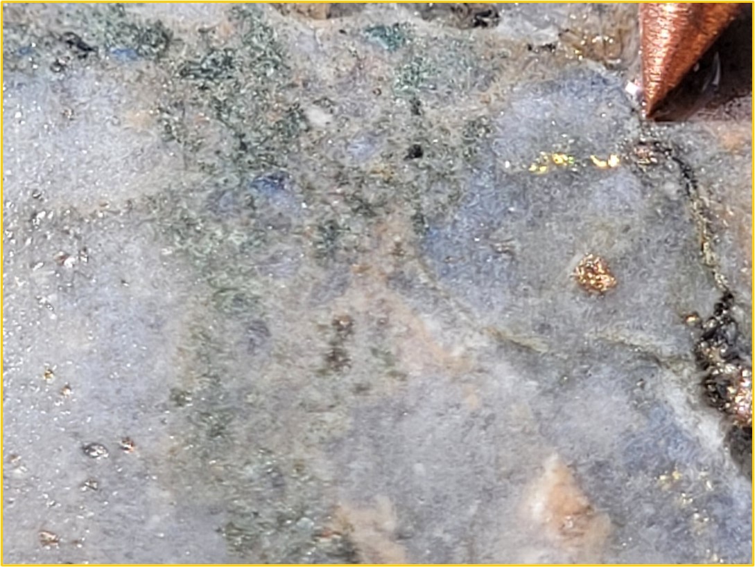 Drillhole 22BT001: visible gold (yellow circle) associated with cross-cutting silicified zone within hydrothermally altered perthitic granite at Galvao. Sample is from 407.00 metres to 408.00 metres, and grades 16.30 g/t gold.