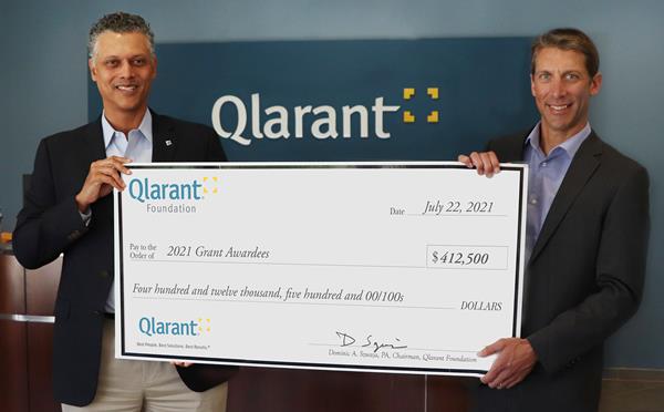 Qlarant CEO Dr. Ron Forsythe, Jr. and Qlarant Foundation Chair Dominic Szwaja present the 2021 Grant Award totaling $412,500.