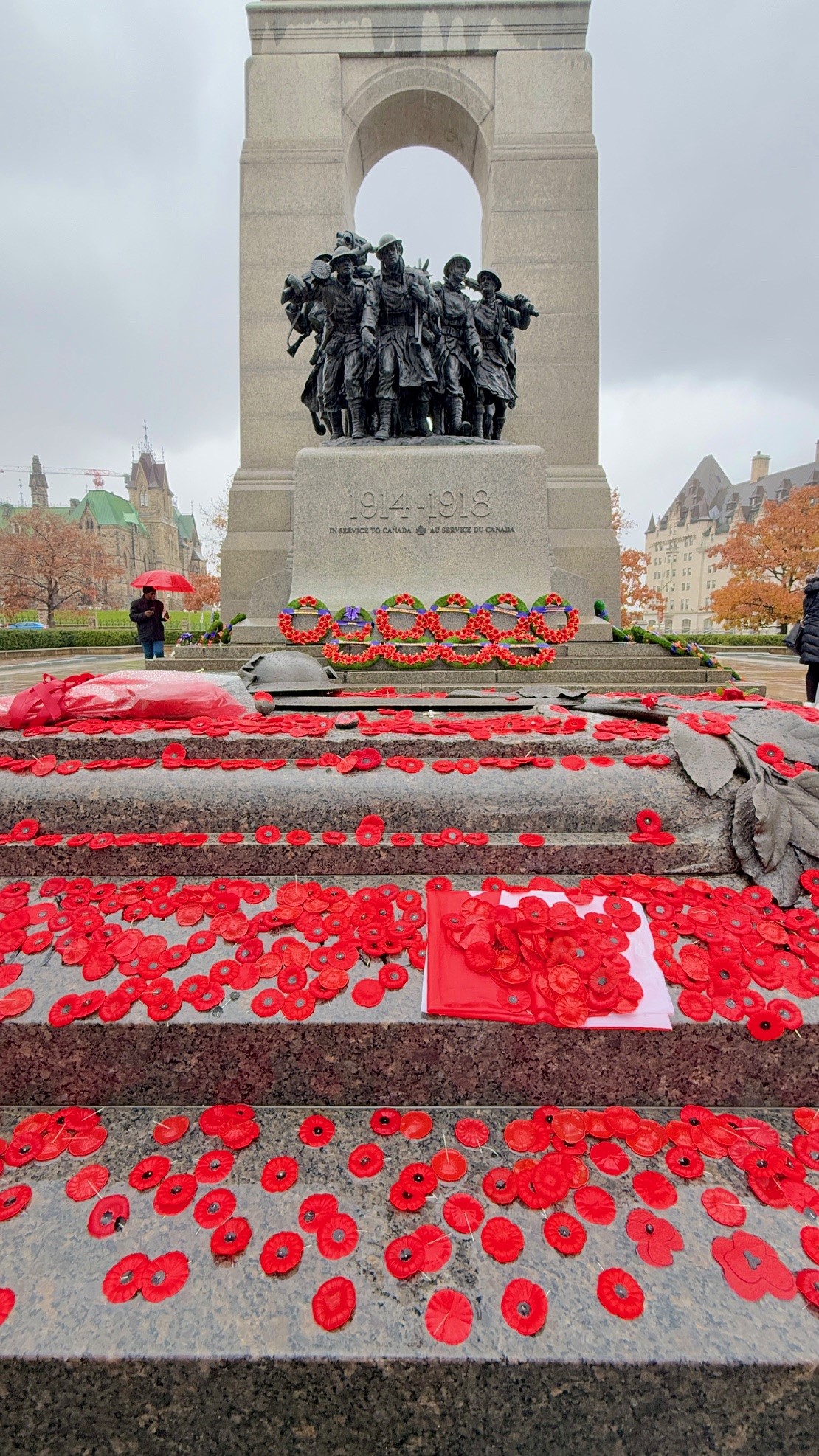 Poppies of Remembrance cover the Tomb of the Unknown Soldier after the ceremony