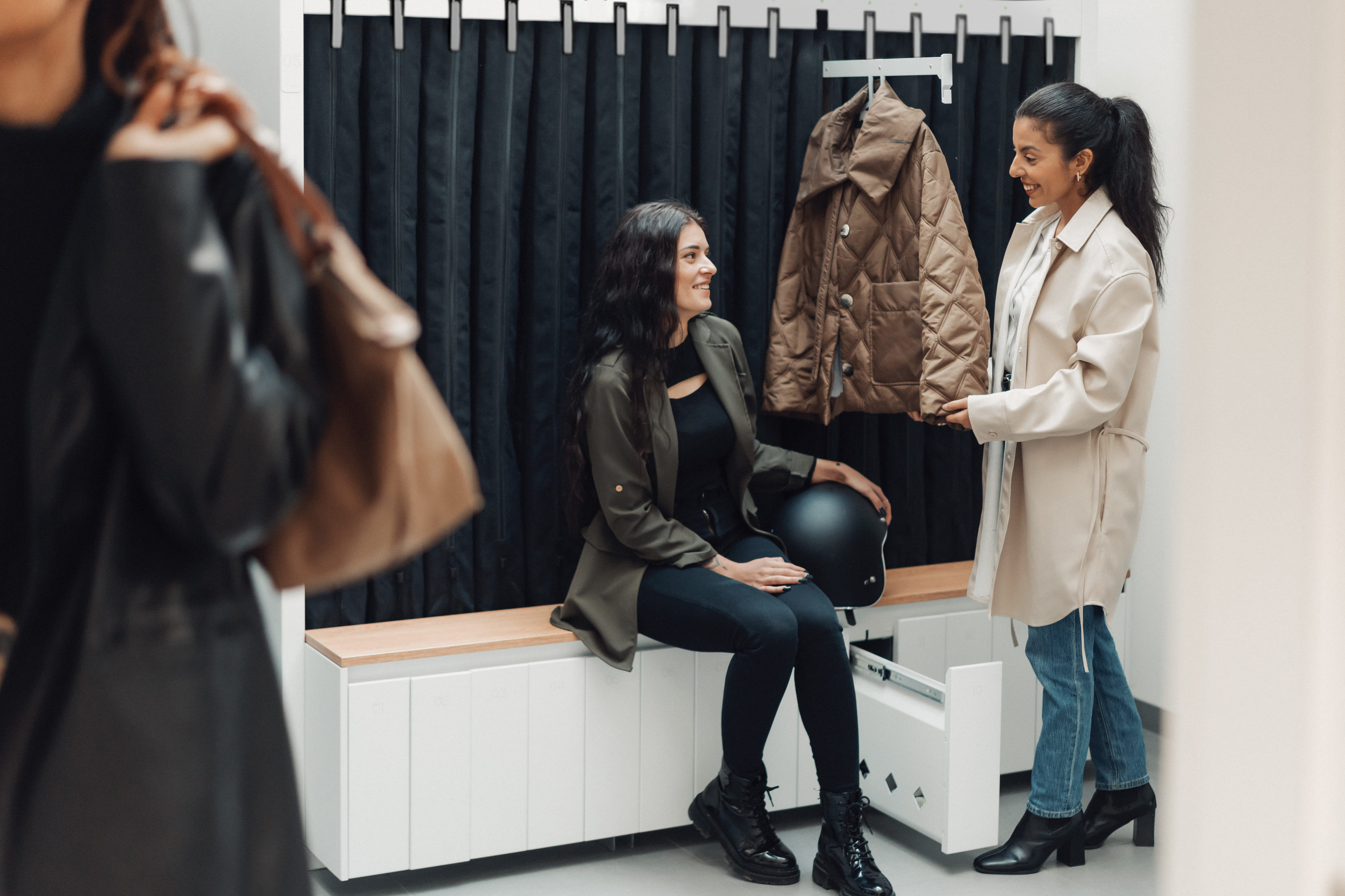 Unique soft locker system with retractable clothes hangers and pockets for personal items