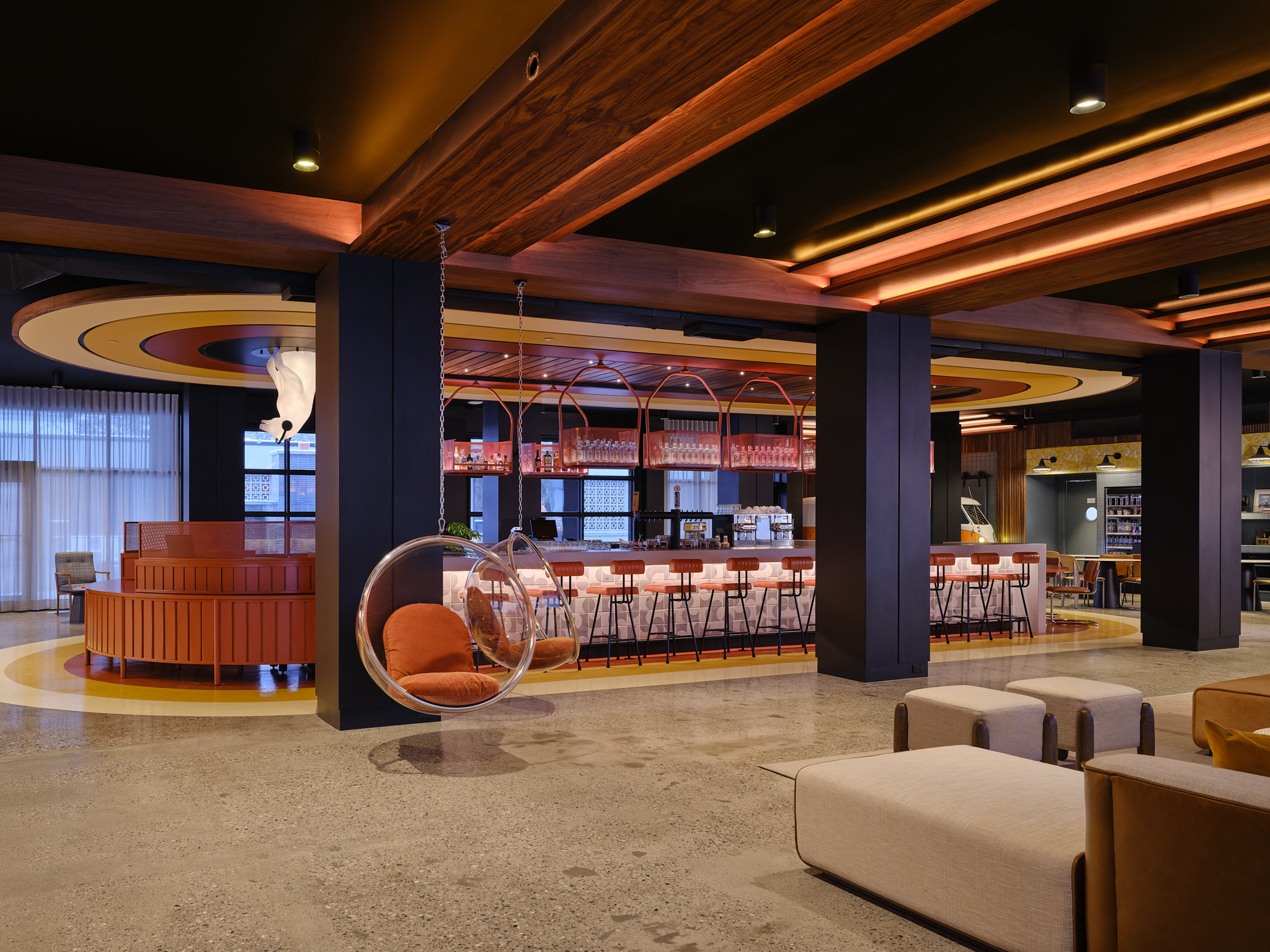 Check-in for your stay, indulge in signature cocktails and one-of-a-kind food offerings at Bar Moxy.