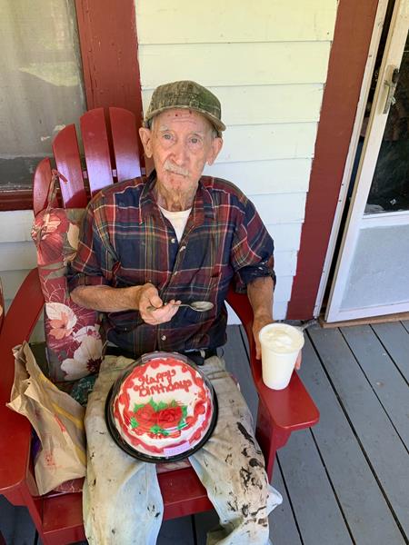 A caseworker helped Parsie celebrate his birthday during a socially-distanced porch visit.