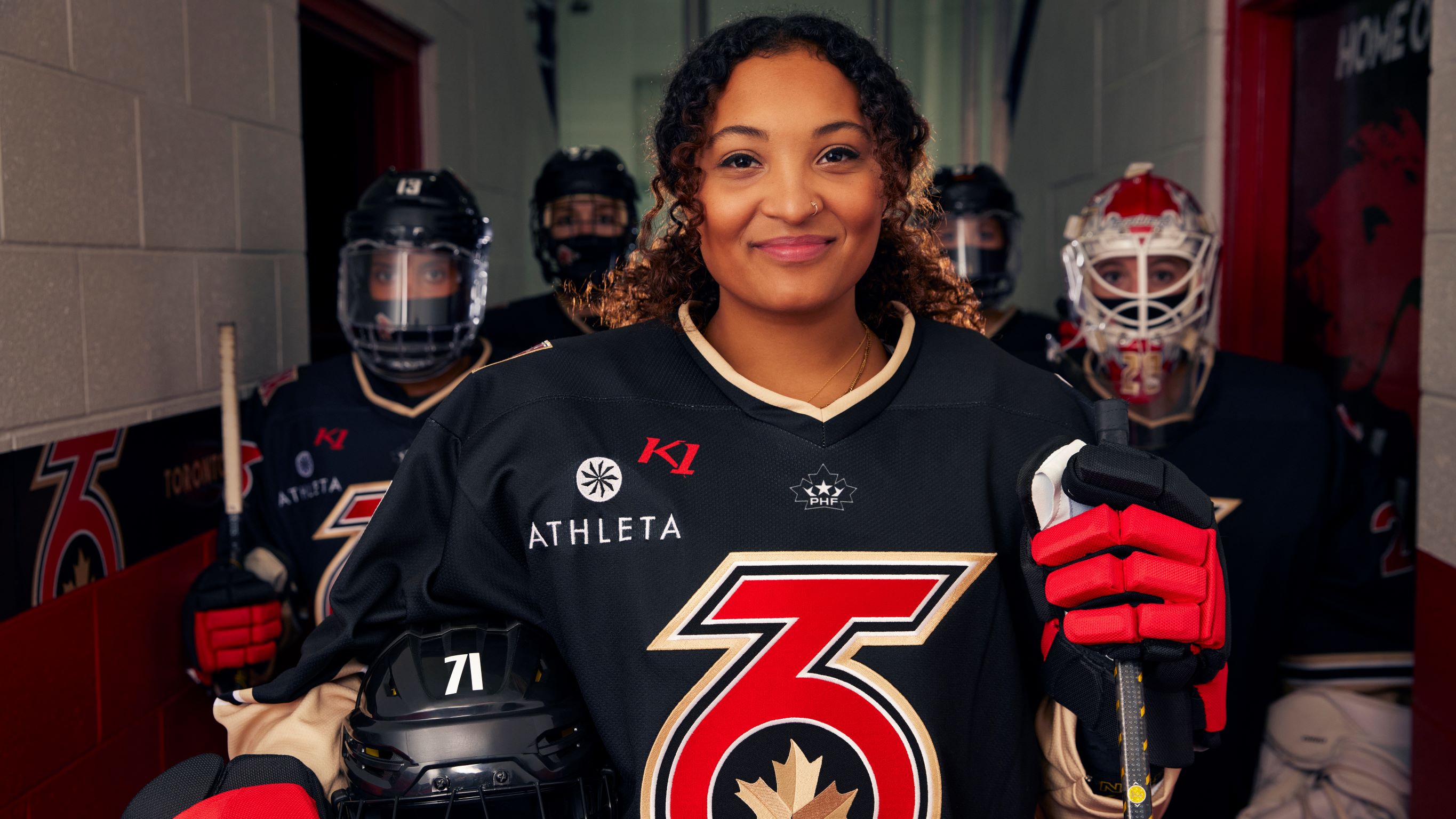 Toronto Six players suit up in their 2021-2022 uniform. Forefront: Saroya Tinker, Background: Shiann Darkangelo, Emma Woods, Mikyla Grant-Mentis, Elaine Chuli