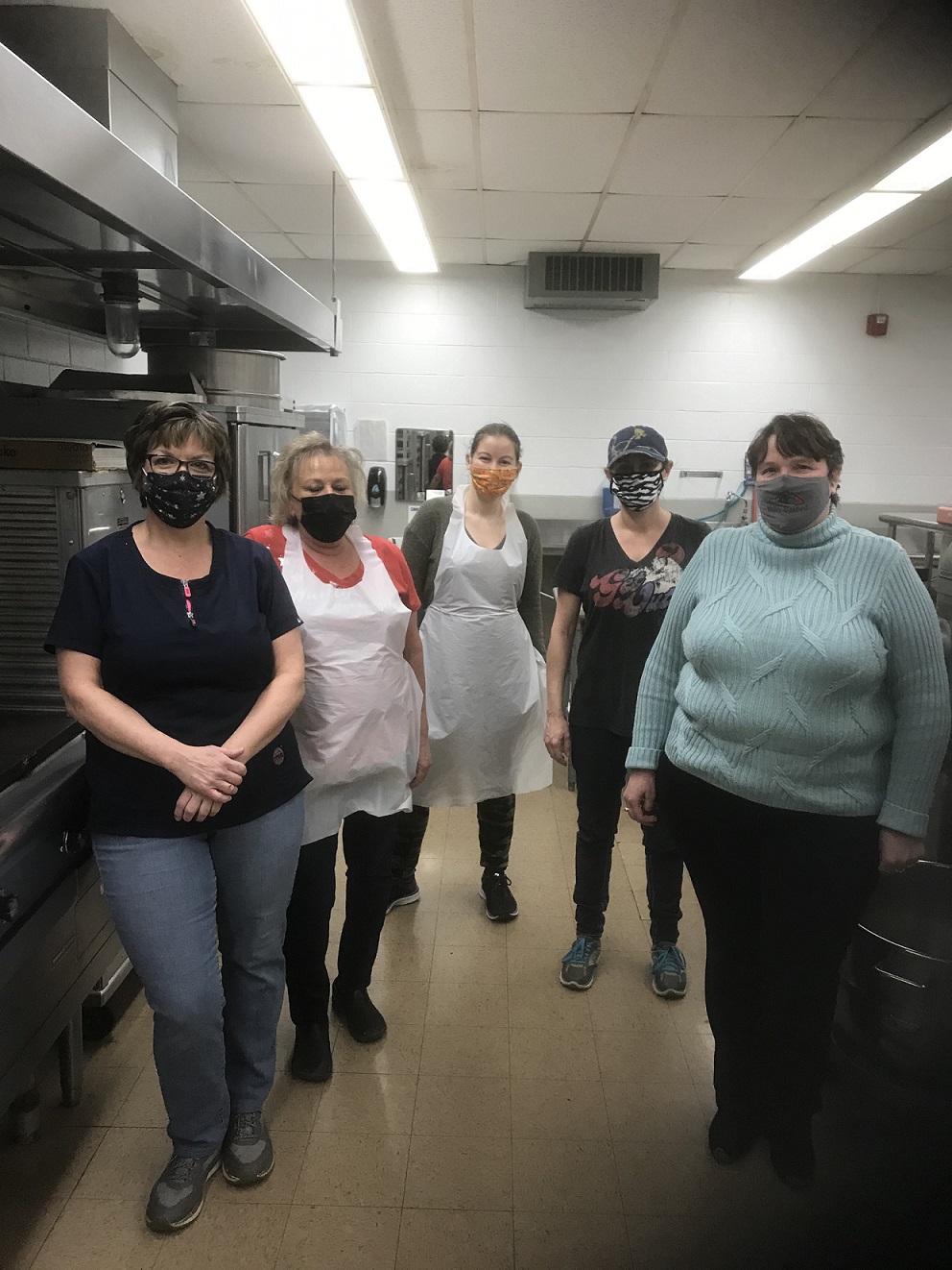 MSAD 27 kitchen staff, from left to right: Jenny Perreault, Sue Pelletier, Melanie Boucher and Angela Adams, with Melanie Lagasse (far right), Food Service Director at Valley Unified Education Service Center (MSAD 27, MSAD 33 and Madawaska School Department). ModivCare connected Lagasse to two woman-owned transportation providers, Town Taxi and L&L Transportation, to help with meal deliveries from December 2020 through February 2021 – with teams dropping off 40 meals, three times a week to students in the area served by Dr. Levesque Elementary School in Frenchville and 60 meals, three times a week in the area served by Fort Kent Community High School.