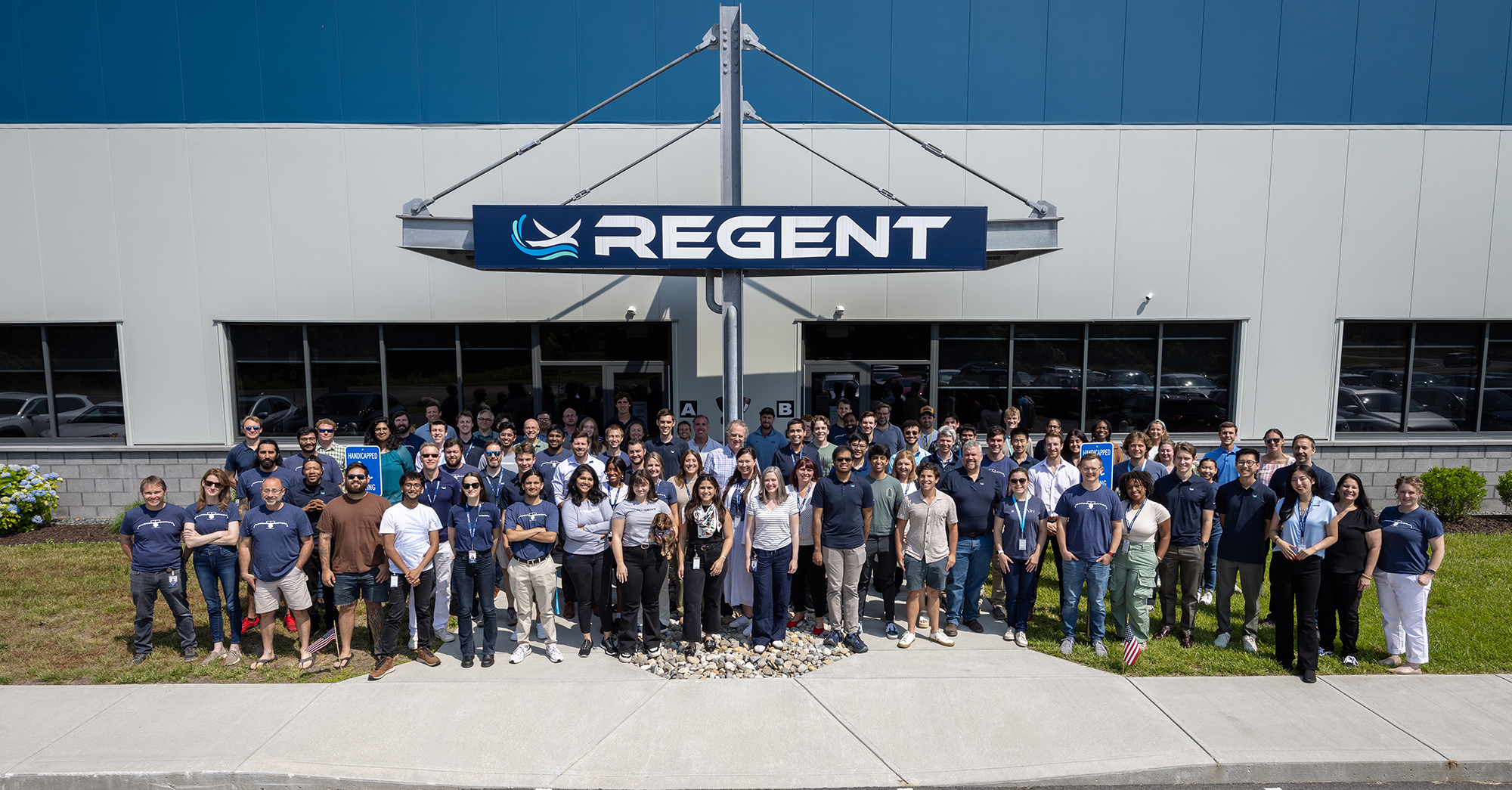 This REGENT team picture was taken in front of the company's headquarters in North Kingstown, RI, in June 2024.