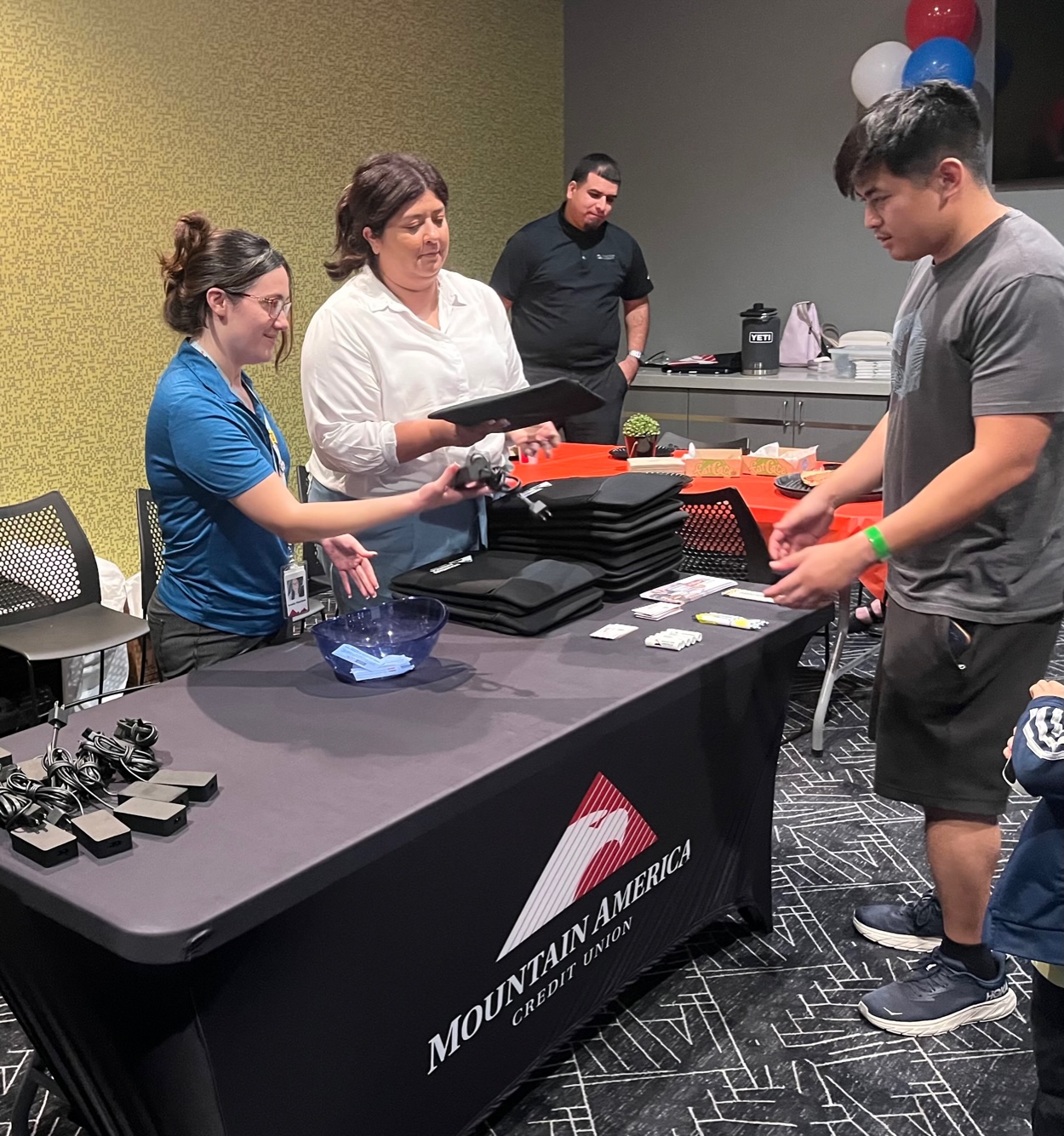 Mountain America Credit Union Partners with USO to Provide Laptops to Military Families: Mountain America Credit Union team members donating laptops to military families