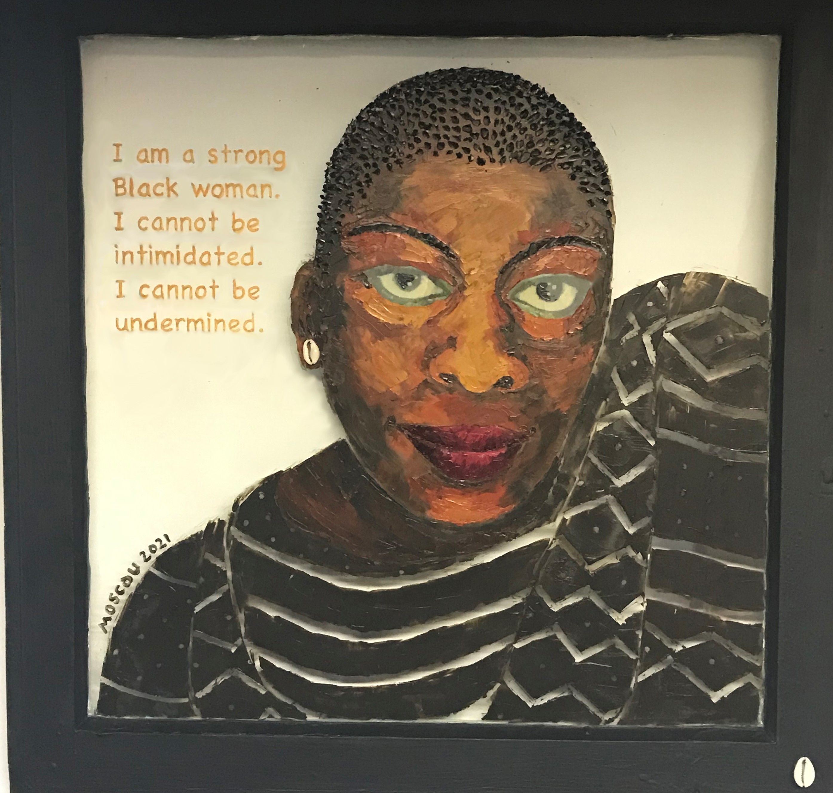 Strong Black Woman #1 is a mixed media work by artist Kathy Moscou (wood, glass, oil and cowrie shell). Size: 24” x 24”
