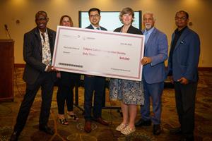Primacorp Ventures presents donation to the Calgary Catholic Immigration Society