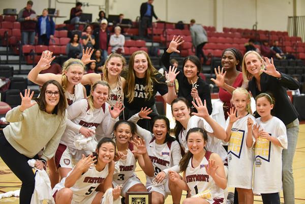 The Westmont women's basketball team celebrates following the Warriors fifth straight Golden State Athletic Conference Tournament Championship on March 7 in Murchison Gym.  